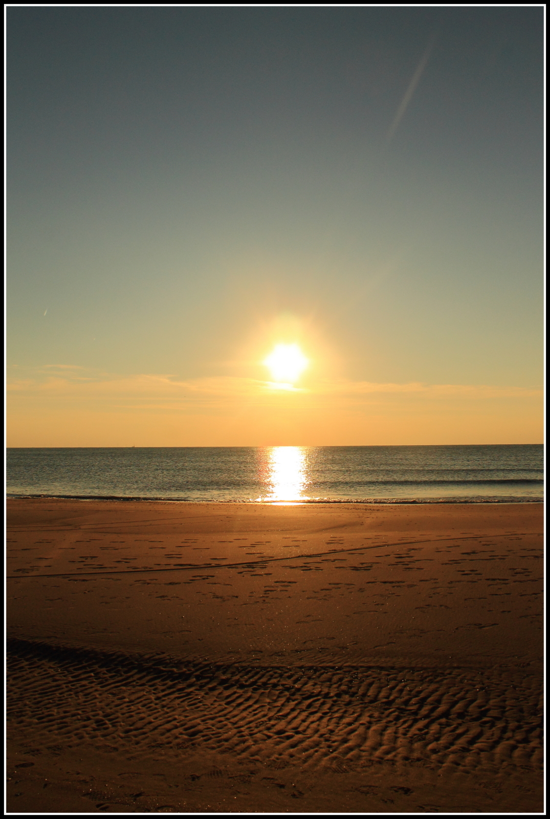 Zonsondergang strand.