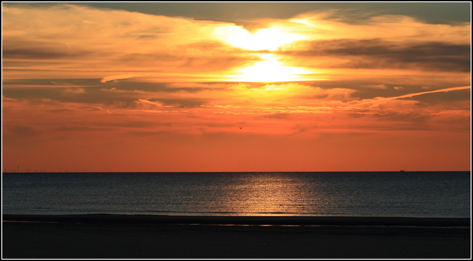 Zonsondergang strand.