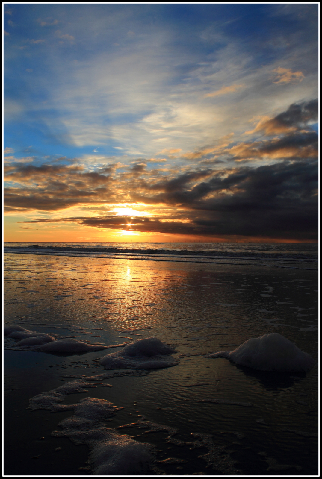 Zonsondergang strand.