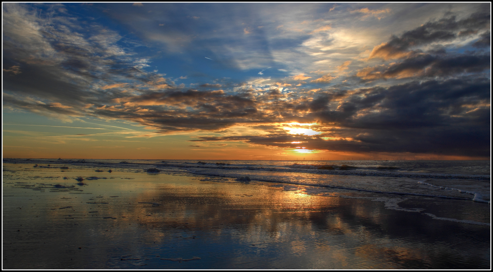Zonsondergang strand.