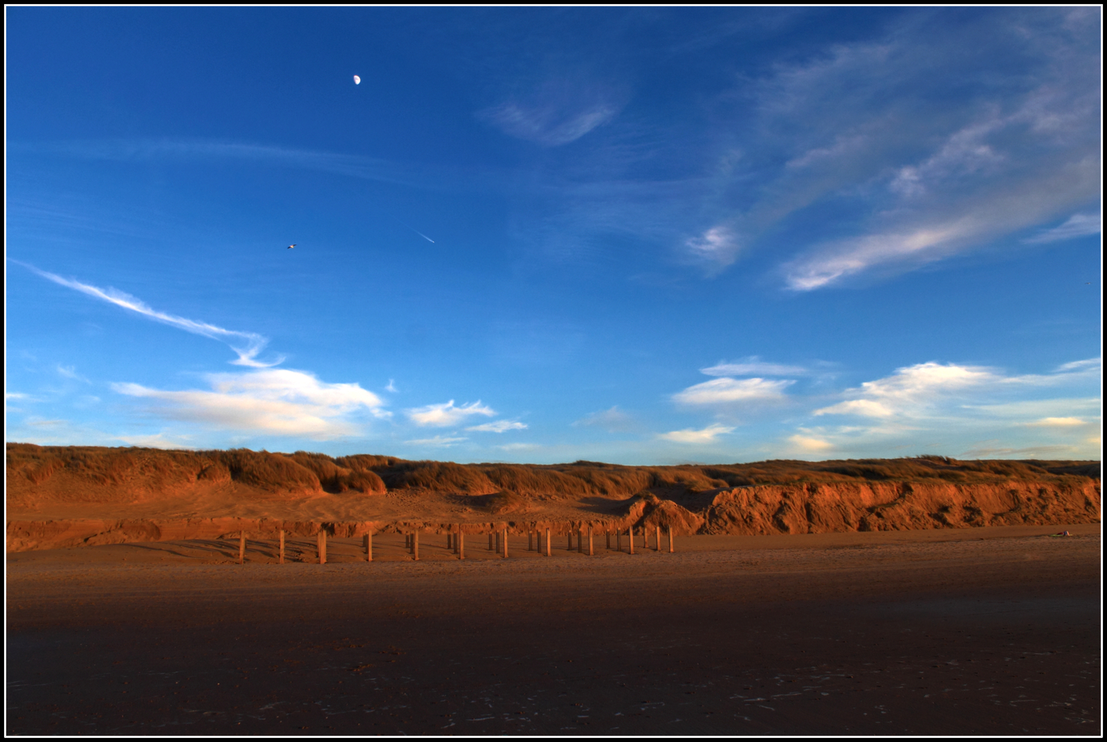 Zonsondergang strand.