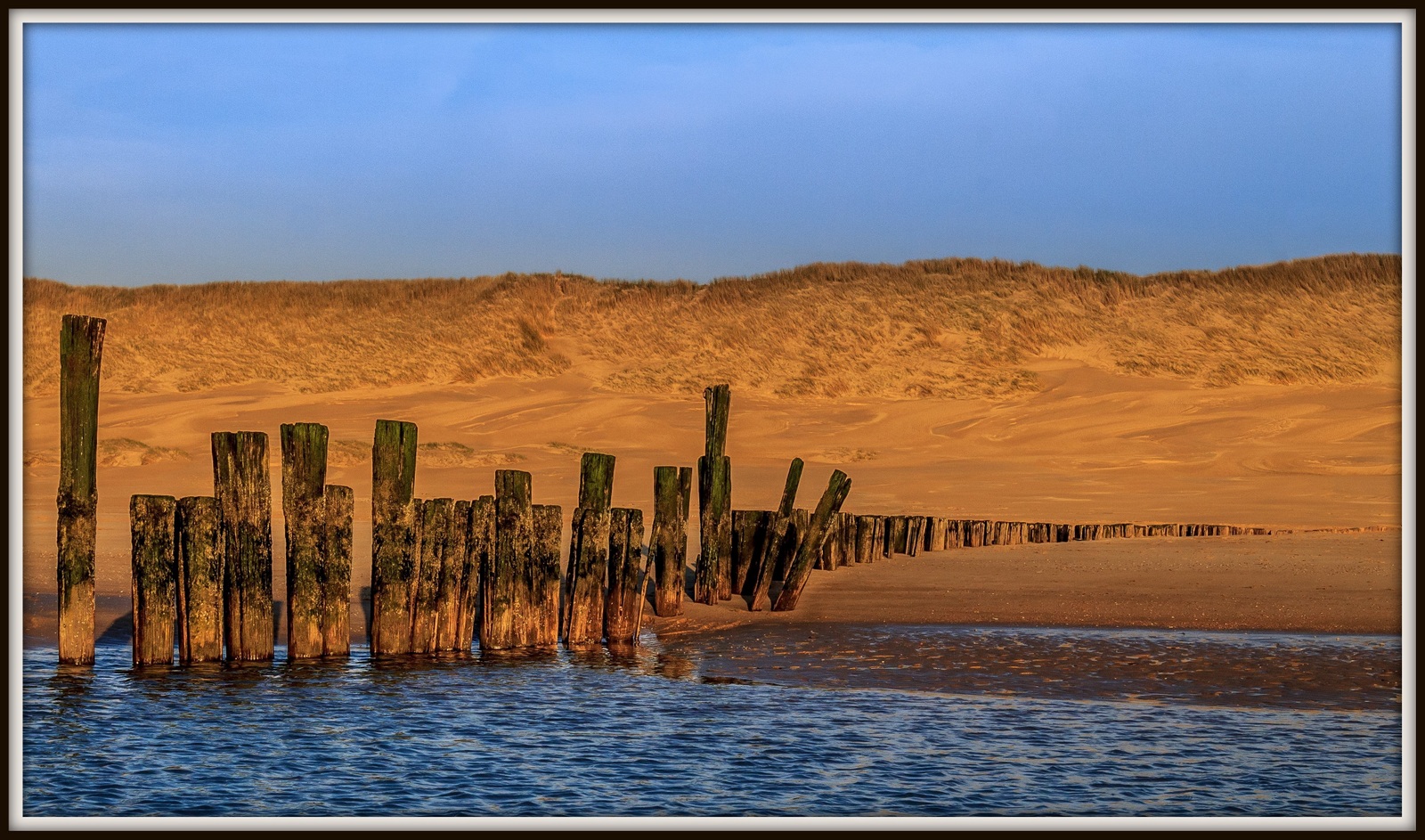 Zonsondergang strand Schoorl.